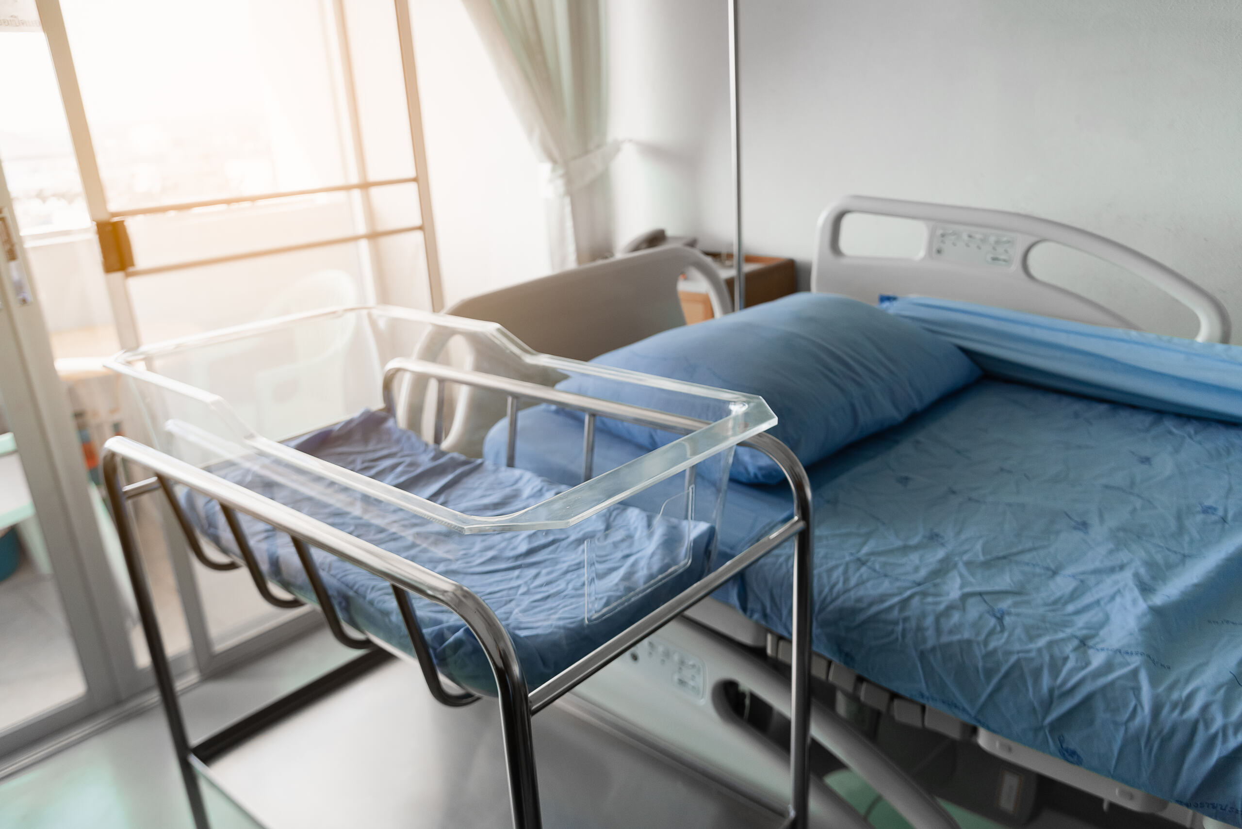 Newborn bassinet beside hospital bed illustrating common birth injuries in Baltimore hospitals